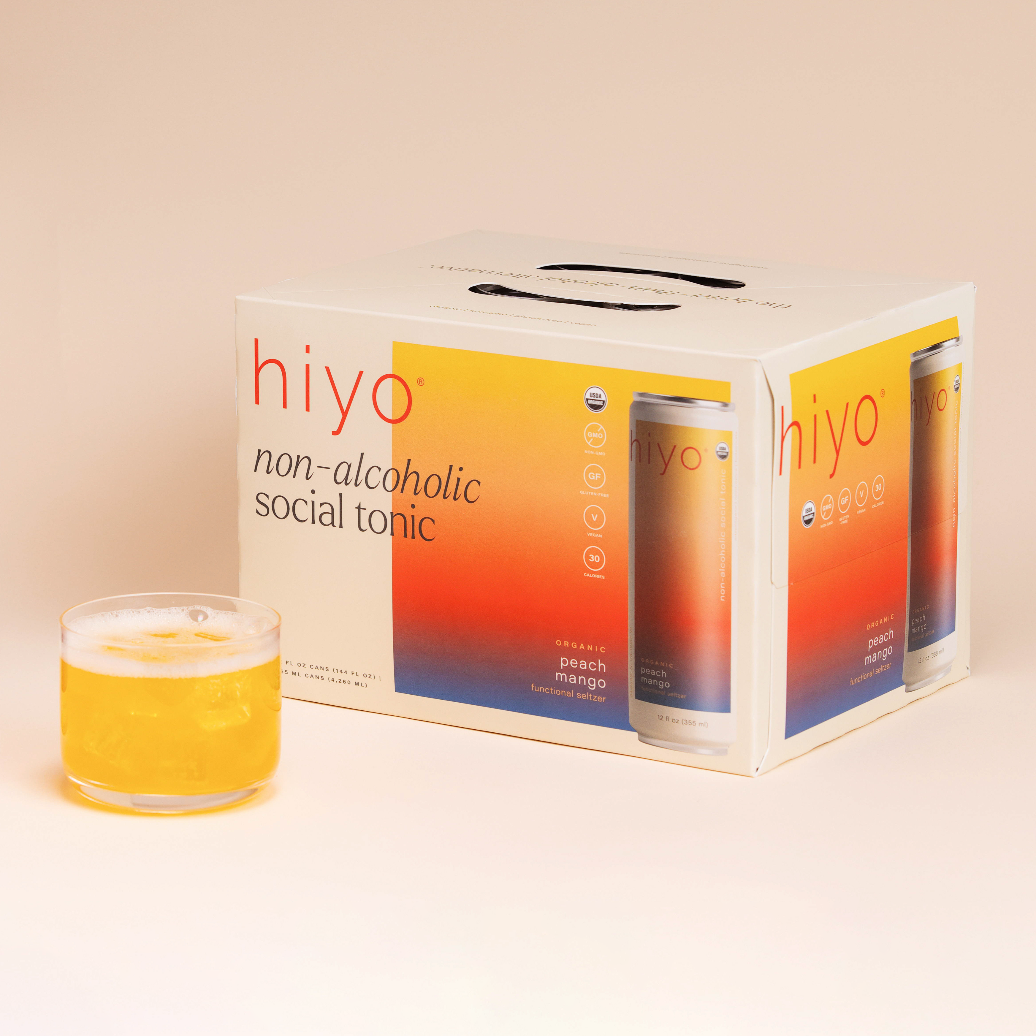 hiyo's peach mango flavor. image includes the 12-pack box and a fizzy, iced glass of the beverage.